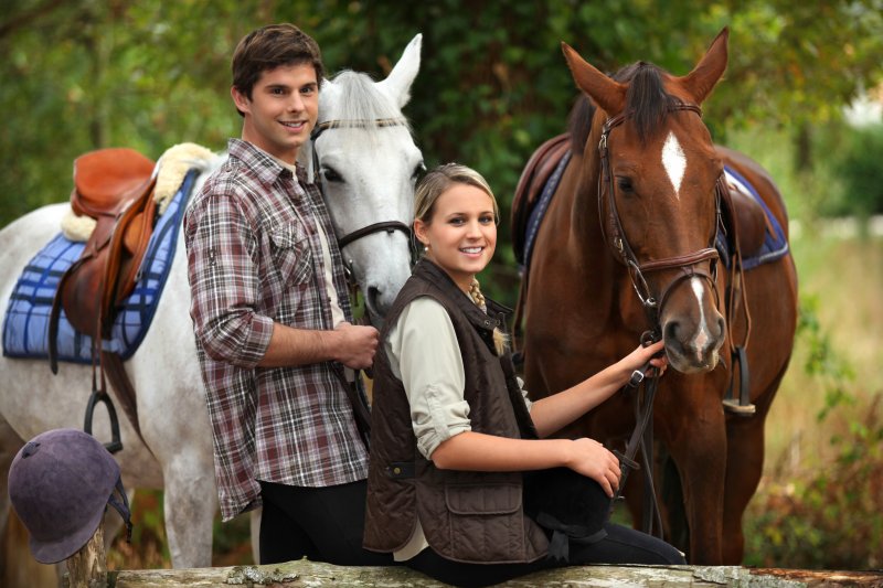 Young people horseriding